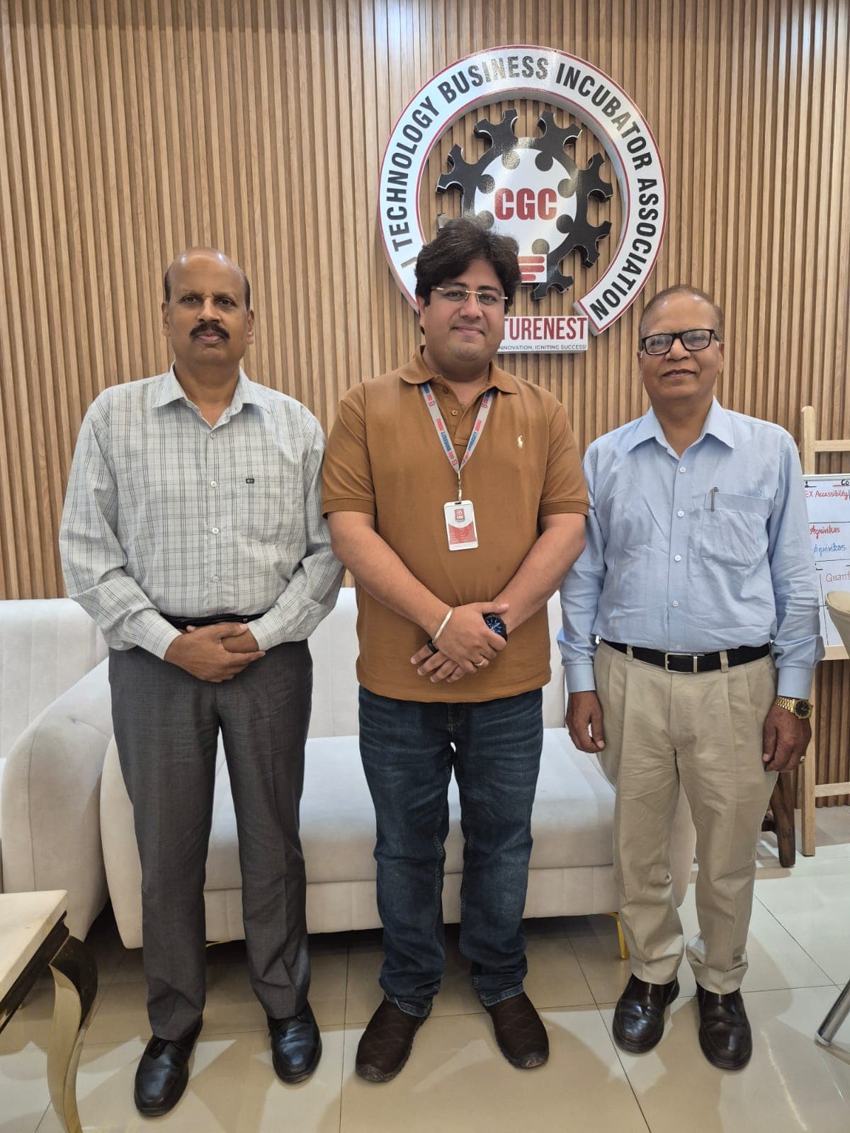 Three people standing together in a bright professional setting