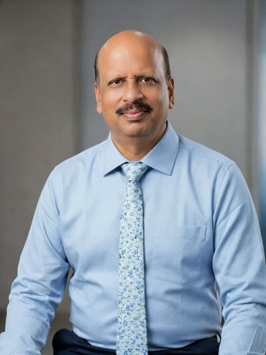 Manejar Singh in a light blue shirt and patterned tie